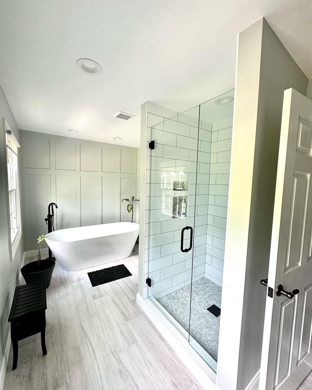 Completed Kaja bathroom remodel with freestanding tub and glass shower